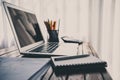 Laptop on the desk of business stylists vintage hipster