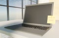 Laptop on desk with work at home yellow sticky notes