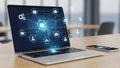 Laptop with digital network interface and smartphone on desk Royalty Free Stock Photo