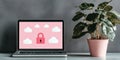 Laptop displaying cloud security interface on screen with green plant background Royalty Free Stock Photo