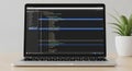 Laptop displaying a code editor with colorful syntax highlighting on black background, Royalty Free Stock Photo