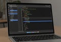 A laptop displaying a code editor Royalty Free Stock Photo
