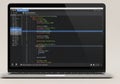 A laptop displaying a code editor Royalty Free Stock Photo