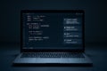 Laptop displaying code editor interface in dimly lit room with update notification. concept of programming, software development Royalty Free Stock Photo