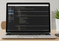 Laptop displaying code editor with programming Royalty Free Stock Photo