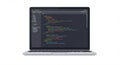 Laptop displaying code editor with syntax-highlighted text on the screen. The Royalty Free Stock Photo