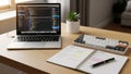 Laptop displaying code on its screen sits on a wooden desk. A mechanical Royalty Free Stock Photo