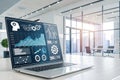 Laptop displaying data analytics in modern office Royalty Free Stock Photo