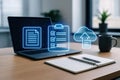 Laptop displaying digital documents and cloud storage icons on a desk computer technology Royalty Free Stock Photo