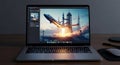 Laptop displaying a dramatic space shuttle launch image Royalty Free Stock Photo