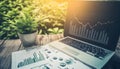 outdoor office setup with laptop displaying a downward trending chart, plant, and financial documents on a rustic wooden surface Royalty Free Stock Photo