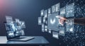 Laptop displaying futuristic holographic charts and data graphs with a hand interacting Royalty Free Stock Photo