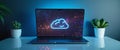 Laptop displaying glowing cloud icon Royalty Free Stock Photo