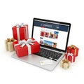 Laptop displaying an online store with gift boxes and wrapping paper around it Royalty Free Stock Photo