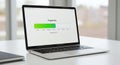 Laptop displaying a progress bar on its screen,