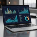 Laptop displaying a series of colorful, data-driven graphs and charts on the screen. Royalty Free Stock Photo