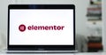 Laptop displays the logo of Elementor, a website builder company for WordPress