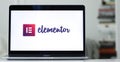 Laptop displays the logo of Elementor, a website builder company for WordPress