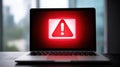 Understanding Phishing Scams With Highlighted Warning Notification on Laptop Screen in Modern Office Setting Royalty Free Stock Photo