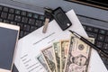 Laptop, document about car purchase, dollar, calculator, pen Royalty Free Stock Photo