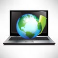 Laptop with earth globe and green arrow Royalty Free Stock Photo