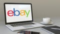 Laptop with eBay Inc. logo on the screen. Modern workplace conceptual editorial 3D rendering