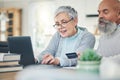 Laptop, elderly couple and credit card in home for online shopping, digital banking or payment. Computer, ecommerce and Royalty Free Stock Photo