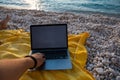 laptop with empty screen at sea beach freelance concept Royalty Free Stock Photo