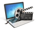 Laptop with films reel and movie clapper, Video or movie online internet concept 3d rendering Royalty Free Stock Photo
