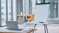 Laptop And Flip Chart In Modern Office Setting. Workspace Prepared For Presentation Or Meeting Royalty Free Stock Photo