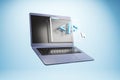 Laptop with floating code window and cursor symbolizing programming concept on blue background in creative technology business Royalty Free Stock Photo