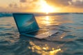 A laptop floats on calm, golden sea at sunset, creating a thought-provoking blend of technology and nature