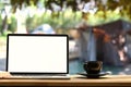 Laptop on folding picnic table near camp tent outdoors. Royalty Free Stock Photo