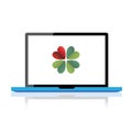 Laptop with four leaf clover Royalty Free Stock Photo
