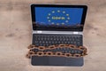 Laptop with GDPR letters in EU stars on wood background Royalty Free Stock Photo