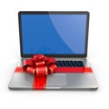 Laptop gift. Bow and ribbon on keyboard