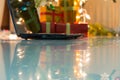 Laptop with gift box and christmas lights Royalty Free Stock Photo