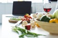 laptop, glass of red wine and vegetables Royalty Free Stock Photo