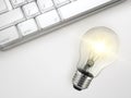 Laptop and glowing light bulb. Self learning or education knowledge and business studying concept. Idea of learning online or e-