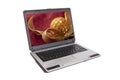 Laptop with golden curly ribbon and ball Royalty Free Stock Photo