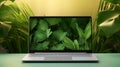 Laptop in green vegetation, representing eco friendliness in build materials