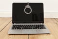 Laptop and handcuff Royalty Free Stock Photo