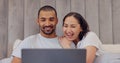 Laptop, happy and young couple in bed watching movie, film or show together at home. Smile, technology and man and woman Royalty Free Stock Photo