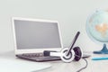 Laptop with headphones on white desk Royalty Free Stock Photo