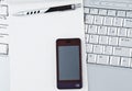 Laptop with Hi-Tech mobile phone. Royalty Free Stock Photo