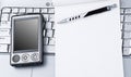 Laptop with Hi-Tech PDA and notepad. Royalty Free Stock Photo