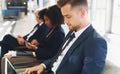 Laptop, hiring and businessman in line for a job interview in corporate global startup company in an office building Royalty Free Stock Photo