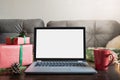 Laptop in home interior for booking, search special Christmas offer. Space for text on display. Planing holidays Royalty Free Stock Photo