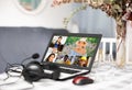 Laptop with image of people participating in video conference closeup