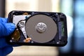 Laptop 2.5 inch hard disk drive storage memory, repair broken computer part, a close up view of an open hard disc with platters, Royalty Free Stock Photo